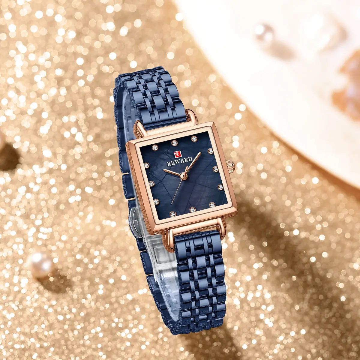 Relógio quadrado feminino pequeno azul Reward VIP Élise visto por cima destacando sua pulseira azul e caixa em ouro rosa